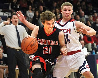 William D. Lewis The Vindicator  Canfield's Zack Tinkey(21) drives around Fitch's Kole Klasic (14) during JAn27, 2017 action at Fitch.