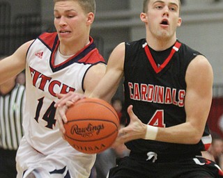 Willaim D Lewis The Vindicator  Fitch's Kole Klasic(14) and Canfield's Brandon McFall(4) go for the ball during Jan. 27, 2017 action at Fitch.