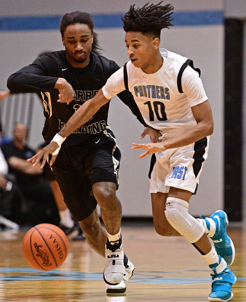 YOUNGSTOWN, OHIO - JANUARY 27, 2017: Terrell Weaver #10 of East drives on Kemon'Dre Muhammad #10 of Harding during the first half of their game Friday night at East High School. DAVID DERMER | THE VINDICATOR