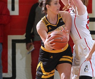 Milwaukee junior guard Jenny Lindner(20) is blocked out from her shot under the net by Youngstown State junior guard Kelley Wright(35) during the third quarter as the Youngstown State Penguins take on the University of Wisconsin Milwaukee Panthers at the Beeghly Center in Youngstown on Saturday, Jan. 28, 2017. The Panthers won, 78-74...(Nikos Frazier | The Vindicator)..