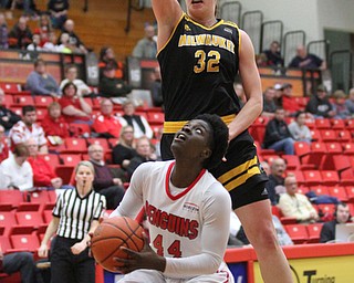 Milwaukee junior forward Steph Kostowicz(32) jumps up to block Youngstown State senior forward Tamira Ford(44) shot during the third quarter as the Youngstown State Penguins take on the University of Wisconsin Milwaukee Panthers at the Beeghly Center in Youngstown on Saturday, Jan. 28, 2017. The Panthers won, 78-74...(Nikos Frazier | The Vindicator)..
