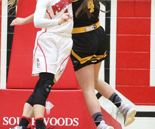 Youngstown State sophomore guard Alison Smolinski(2) tries to block Milwaukee junior guard Bailey Farley(4)'s shot during the fourth quarter as the Youngstown State Penguins take on the University of Wisconsin Milwaukee Panthers at the Beeghly Center in Youngstown on Saturday, Jan. 28, 2017. The Panthers won, 78-74...(Nikos Frazier | The Vindicator)..