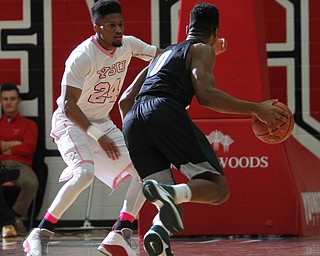 Cleveland State junior forward Derek Slaon(0) dribbles towards the net against Youngstown State junior guard Cameron Morse(24) during the first half as the Youngstown State Penguins take on the Cleveland State Vikings at the Beeghly Center in Youngstown on Saturday, Jan. 28, 2017. The Penguins won, 67-64...(Nikos Frazier | The Vindicator)..