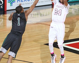 Youngstown State junior guard Cameron Morse(24) goes up for three as Cleveland State junior guard Kenny Carpenter(1) tries to block his shot during the first half as the Youngstown State Penguins take on the Cleveland State Vikings at the Beeghly Center in Youngstown on Saturday, Jan. 28, 2017. The Penguins won, 67-64...(Nikos Frazier | The Vindicator)..