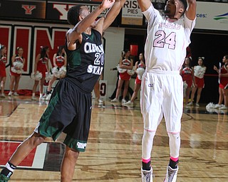 Youngstown State junior guard Cameron Morse(24) goes up for three as Cleveland State junior guard Bobby Word(20) tries to block his shot during the first half as the Youngstown State Penguins take on the Cleveland State Vikings at the Beeghly Center in Youngstown on Saturday, Jan. 28, 2017. The Penguins won, 67-64...(Nikos Frazier | The Vindicator)..