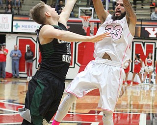 Youngstown State junior guard Francisco Santiago(23) goes up for two against Cleveland State junior guard Tim Hasbargen(21) during the first half as the Youngstown State Penguins take on the Cleveland State Vikings at the Beeghly Center in Youngstown on Saturday, Jan. 28, 2017. The Penguins won, 67-64...(Nikos Frazier | The Vindicator)..