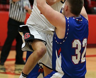 MICHAEL G TAYLOR | THE VINDICATOR- 01-28-17 -Basketball-  1st qtr., Struther's #2 Carson Ryan drives  against Reserve's #32 Cody Hilles.  Western Reserve Blue Devils  vs Struthers Wildcats at Struthers High School in Struthers Fieldhouse, Struthers,, OH..