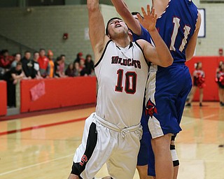 MICHAEL G TAYLOR | THE VINDICATOR- 01-28-17 -Basketball-  2nd qtr., Struther's #10 AJ Musolino has his shot rejected by Reserve's #11Caleb Quinn.  Western Reserve Blue Devils vs Struthers Wildcats at Struthers High School in Struthers Fieldhouse, Struthers, OH.