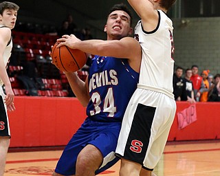 MICHAEL G TAYLOR | THE VINDICATOR- 01-28-17 -Basketball-  3rd qtr., Struther's #2 Carson Ryan stops the drive of Reserve's #34 Jack Cappabianca.  Western Reserve Blue Devils vs Struthers Wildcats at Struthers High School in Struthers Fieldhouse, Struthers, OH..
