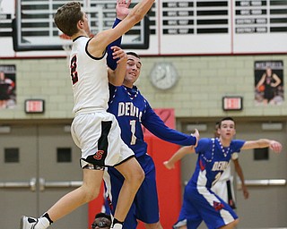  MICHAEL G TAYLOR | THE VINDICATOR- 01-28-17 -Basketball-  3rd qtr., Struther's #2 Carson Ryan pass against the defense of Reserve's #1 Wyatt Larimer.  Western Reserve Blue Devils  vs Struthers Wildcats at Struthers High School in Struthers Fieldhouse, Struthers,, OH..