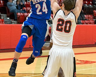 MICHAEL G TAYLOR | THE VINDICATOR- 01-28-17 -Basketball-  Late 4th qtr., Reserve's #24  Kade Hilles shoots over Struther's #20 Ryan Leonard.  Western Reserve Blue Devils  vs Struthers Wildcats at Struthers High School in Struthers Fieldhouse, Struthers, OH.