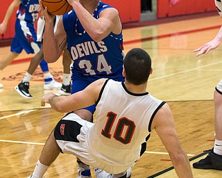 MICHAEL G TAYLOR | THE VINDICATOR- 01-28-17 -Basketball-  Last seconds of the game qtr., Struther's #10 AJ Musolino draws the charging foul against Reserve's #34 Jack Cappabianca.  Western Reserve Blue Devils vs Struthers Wildcats at Struthers High School in Struthers Fieldhouse, Struthers, OH..