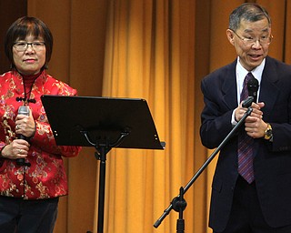 Pastors May(left) and Jeff Yeh, head of the Chinese Mission at Poland United Methodist Church, welcome guests to the Chinese New Year Celebration at Poland United Methodist Church in Poland on Sunday, Jan. 29, 2017. ..(Nikos Frazier | The Vindicator)..