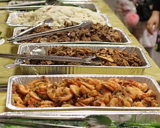 Chinese Food is lined up on a banquet table during the Chinese New Year Celebration at Poland United Methodist Church in Poland on Sunday, Jan. 29, 2017. ..(Nikos Frazier | The Vindicator)..