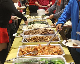 Guests plate Chinese food during the Chinese New Year Celebration at Poland United Methodist Church in Poland on Sunday, Jan. 29, 2017. ..(Nikos Frazier | The Vindicator)..