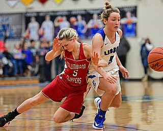 LISBON, OHIO - JANUARY 30, 2017: Chloe Smith #5 of Lisbon loses control of the ball while falling to the floor after colliding with Grace Hammond #5 of Columbiana during the second half of their game Monday night at Lisbon High School. DAVID DERMER | THE VINDICATOR