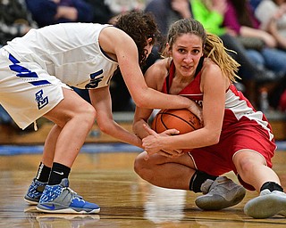 LISBON, OHIO - JANUARY 30, 2017: Mariah Rovnak #13 of Columbiana battle with Karlee Pezzano #2 of Lisbon for the loose ball during the second half of their game Monday night at Lisbon High School. DAVID DERMER | THE VINDICATOR