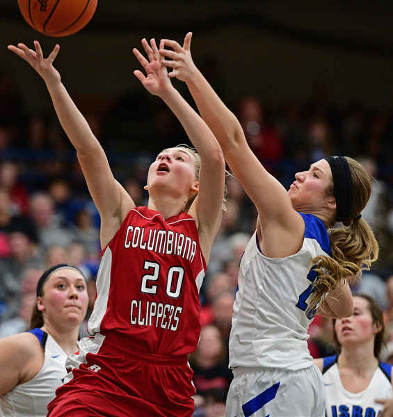 LISBON, OHIO - JANUARY 30, 2017: Alexis Cross #20 of Columbiana goes to the basket while being pressured by Autumn Oehlstrom #20 of Lisbon during the second half of their game Monday night at Lisbon High School. DAVID DERMER | THE VINDICATOR