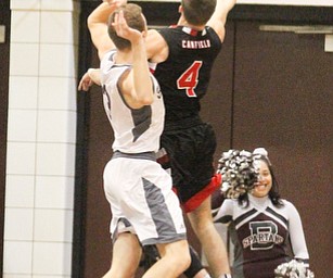Canfield senior guard Brandon McFall goes up for the layup against Boardman junior guard Holden Lipke(3)during the first quarter as Canfield High School takes on Boardman High School at Boardman High School  in Boardman on Tuesday, Jan. 31, 2017. Boardman won 51-44...(Nikos Frazier | The Vindicator)..