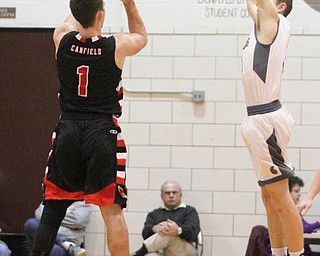 Canfield senior guard Jake Cmmings(1) goes up for three as Boardman junior guard Holden Lipke(3) tries to block the shot during the first quarter as Canfield High School takes on Boardman High School at Boardman High School  in Boardman on Tuesday, Jan. 31, 2017. Boardman won 51-44...(Nikos Frazier | The Vindicator)..