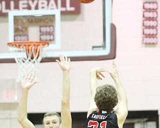 Canfield junior guard Zach Tinkey(21) shoots for three during the second quarter as Canfield High School takes on Boardman High School at Boardman High School  in Boardman on Tuesday, Jan. 31, 2017. Boardman won 51-44...(Nikos Frazier | The Vindicator)..