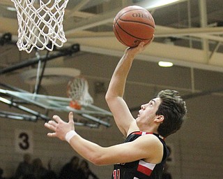 Canfield junior forward Spencer Woolley(11) goes up for the layup during the third quarter as Canfield High School takes on Boardman High School at Boardman High School  in Boardman on Tuesday, Jan. 31, 2017. Boardman won 51-44...(Nikos Frazier | The Vindicator)..