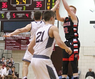 Canfield junior guard Ian McGraw goes up for three during the third quarter as Canfield High School takes on Boardman High School at Boardman High School  in Boardman on Tuesday, Jan. 31, 2017. Boardman won 51-44...(Nikos Frazier | The Vindicator)..