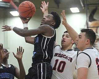 William D Lewis The Vindicator Easts Calvaughn Bryant(4) drives past Struther'sAJ Musolino(10) and Jaret Jacubec(24) during Jan. 31, 2017 action at Struthers.