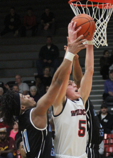 William D Lewis The Vindicator Easts Terrell Engles(11) and Struther's Andrew Carbon(5) go for a rebound during Jan. 31, 2017 action at Struthers.