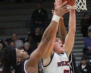 William D Lewis The Vindicator Easts Terrell Engles(11) and Struther's Andrew Carbon(5) go for a rebound during Jan. 31, 2017 action at Struthers.