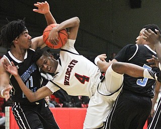 William D Lewis The Vindicator Struther's Jajuan Douglas(4) collides with East's Terrell Engles(11) and Vonzell Matlock(3) while bringing down a rebound during Jan. 31, 2017 action at Struthers.