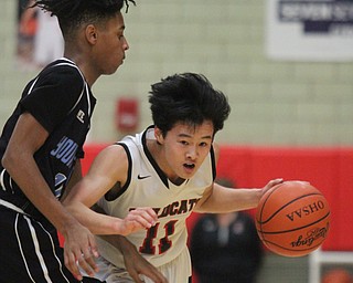 William D Lewis The Vindicator EStruthers Ethsan Vo(11) drives past East's Terrell Weaver(10)) during Jan. 31, 2017 action at Struthers.