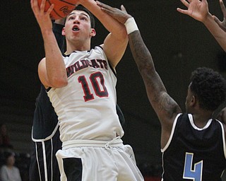 William D Lewis The VindicatorStruthers AJ Musolino(10) shoots over Easts Calvaughn Bryant (4) during Jan. 31, 2017 action at Struthers.