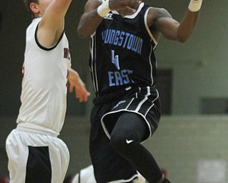 William D Lewis The Vindicator Easts Calvaughn Bryant(4) drives past Struther's Carson Ryan(2)) during Jan. 31, 2017 action at Struthers.