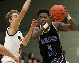 William D Lewis The Vindicator Easts Calvaughn Bryant(4) drives past Struther's Carson Ryan(2)) during Jan. 31, 2017 action at Struthers.