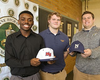        ROBERT K. YOSAY  | THE VINDICATOR...National Signing Day at Ursuline as  Dakota Hobbs (Malone) Spencer Warren ( Wheaton) and Jeff Marx (Navy).