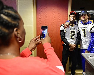 WARREN, OHIO - FEBRUARY 1, 2017:  Lynn Bowden and Marlin Richardson pose for a picture while Tawnya Barnes, Marlin Richardson's mother, snaps a photo on her phone, Wednesday morning at Warren Harding High School. DAVID DERMER | THE VINDICATOR