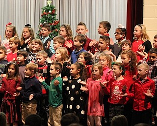 Neighbors | Abby Slanker.Hilltop Elementary School second-grade students performed “Up on the Housetop/Jolly Old St. Nicholas” during the school’s annual Holidays Around the World program on Dec. 20.