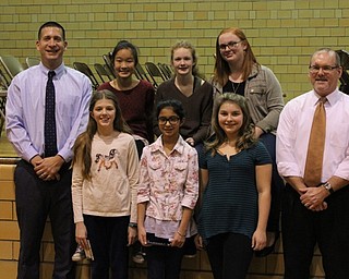 Neighbors | Abby Slanker.Canfield Village Middle School principal Judd Rubin (left) congratulated the 2016 school champion and grade level winners at the Canfield Village Middle School Spelling Bee on Dec. 21. Pictured are, from left, (front) fifth-grade co-champs Aubree Neuhaus and Harjote Kaur, overall winner Delaney Pallo, guest pronouncer Youngstown State University English professor Jeffrey Buchanan; (back) sixth-grade champion Grace Min, seventh-grade champion Jaelyn Palmer and runner-up and eighth-grade champion Maggie Carrier.