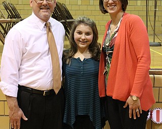 Neighbors | Abby Slanker.Eighth-grade Canfield Village Middle School student Delaney Pallo (middle) was crowned the 2016 school champion of the annual Spelling Bee Dec. 21. Congratulating her were guest pronouncer Youngstown State University English professor Jeffrey Buchanan (left) and spelling bee coordinator Erica Putro..