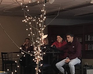 Neighbors | Alexis Bartolomucci.Austintown Fitch students listened to a fellow student reading a poem during the Creative Arts Night on Jan. 12.