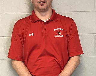 Neighbors | Submitted.Dean Conley, Canfield’s wrestling coach was named Division II Coach of the year.