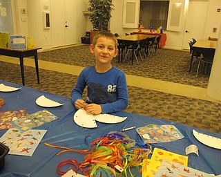 Neighbors | Alexis Bartolomucci.Carter made a jellyfish during the Celebrate Summer program at the Austintown library on Jan. 19.