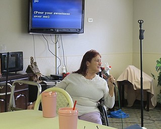 Neighbors | Alexis Bartolomucci.Barb Walter sang "Sugar, Sugar" by The Archies during the monthly karaoke program at Beeghly Oaks on Jan. 17.
