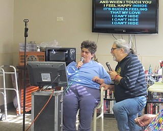 Neighbors | Alexis Bartolomucci.Shelly Gabler and Ed Marsco sang a few songs by The Beatles during the monthly karaoke program at Beeghly Oaks on Jan. 17.