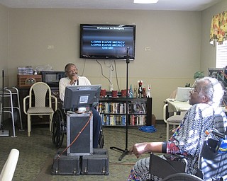 Neighbors | Alexis Bartolomucci.Harold Thomsoon sang "Stormy Monday" while Elizabeth Johnson danced along during the karaoke program on Jan. 17.