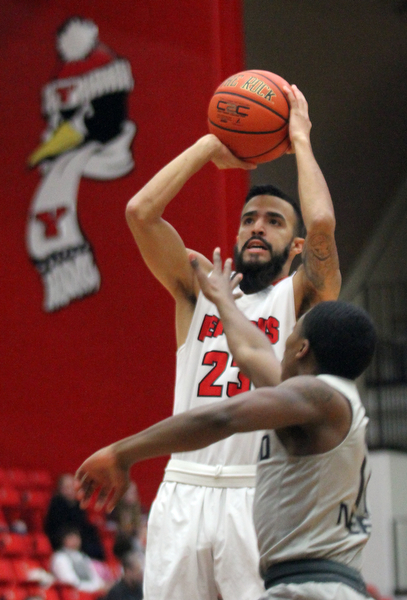 William D. Lewis The Vindicator  YWSU Francisco Santiago (23) shoots over Oakland's Brailen Neely(11) during Feb 2, 2017 action at YSU.