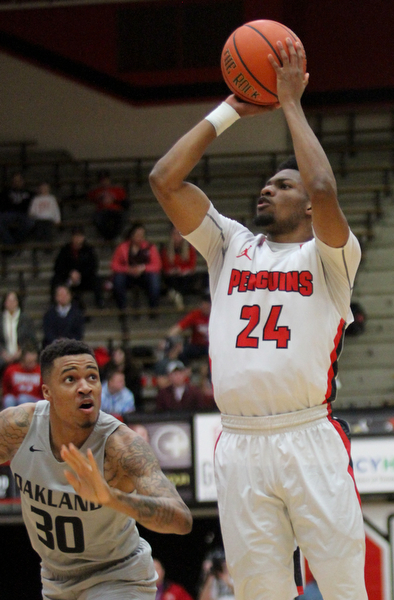 William D. Lewis The Vindicator  YSU Cam Morse(24) shoots over Oakland's Sherron Dorsey-Walker(30) during Feb 2, 2017 action at YSU.