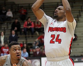 William D. Lewis The Vindicator  YSU Cam Morse(24) shoots over Oakland's Sherron Dorsey-Walker(30) during Feb 2, 2017 action at YSU.