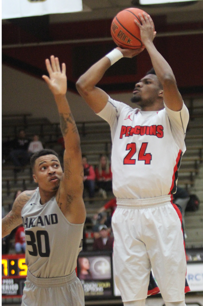 William D. Lewis The Vindicator  YSU Cam Morse(24) shoots over Oakland's Sherron Dorsey-Walker(30) during Feb 2, 2017 action at YSU.